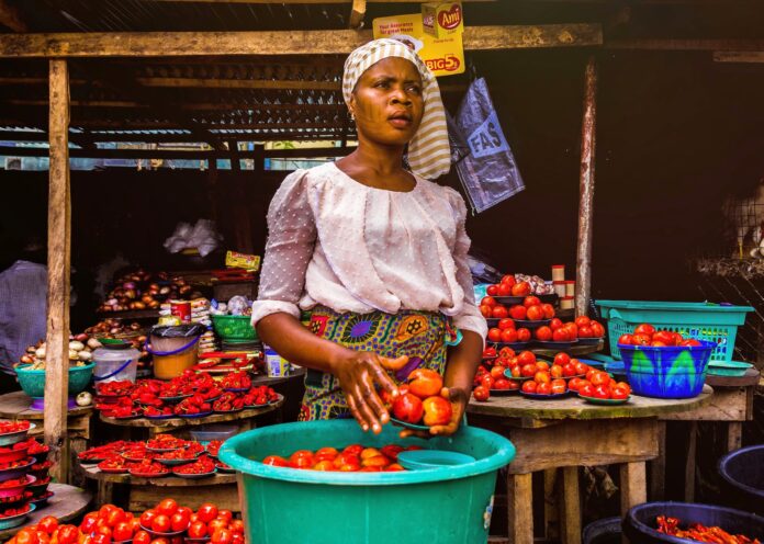 pexels-photo-3213283 woman holding tomatoes
