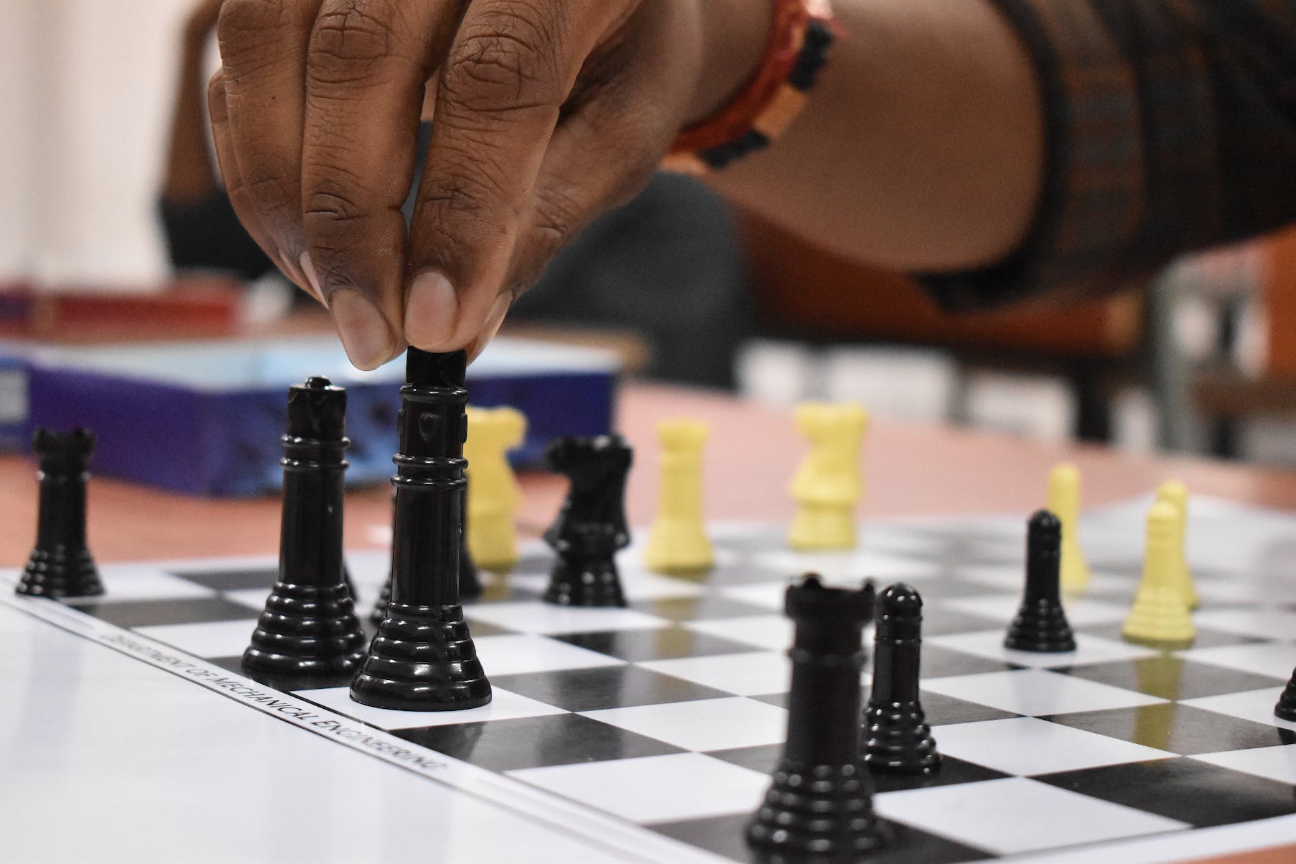 black and yellow chess pieces
