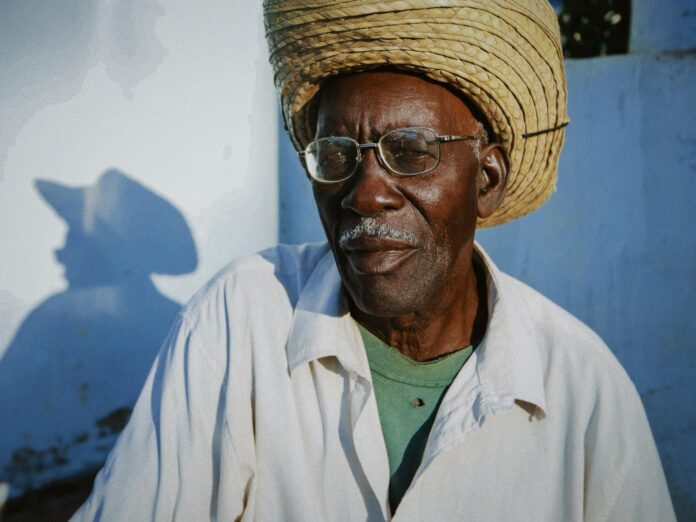 elderly man in straw hat portrait outdoors